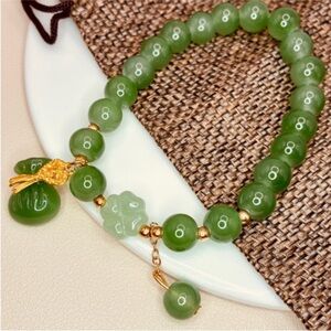 Green Crystal Beaded Bracelet with Jade Lucky Money Bag Gold Accents